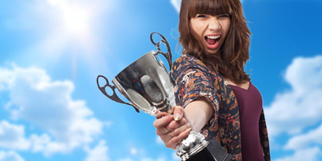 Woman holding victory cup