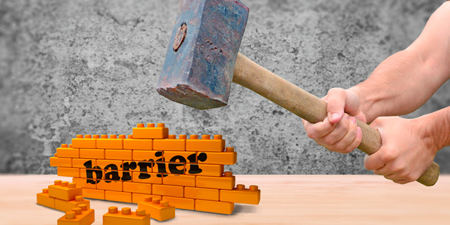 Hammer hitting wall with text "barrier"on it.